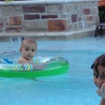 James and Ty in the pool at the apartment in Texas