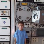 James in a Space Camp Display